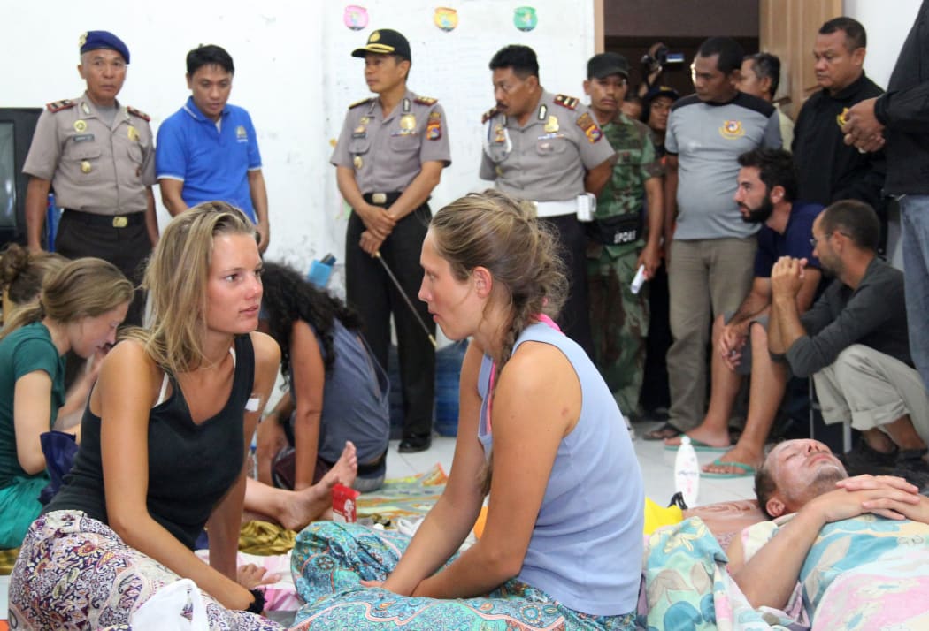 Survivors from the boat recover at a house near the Indonesian town of Bima.