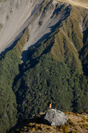 Laura Young attempting to attract Kea with a Kea caller, Doubtful Valley, North Canterbury