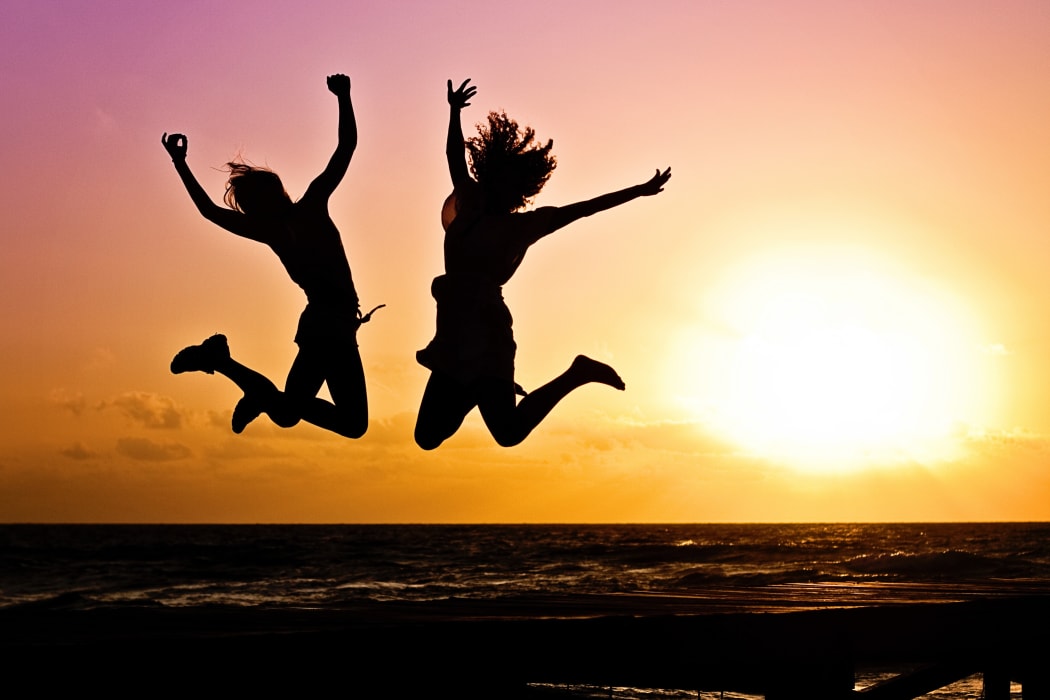 women jumping joyfully