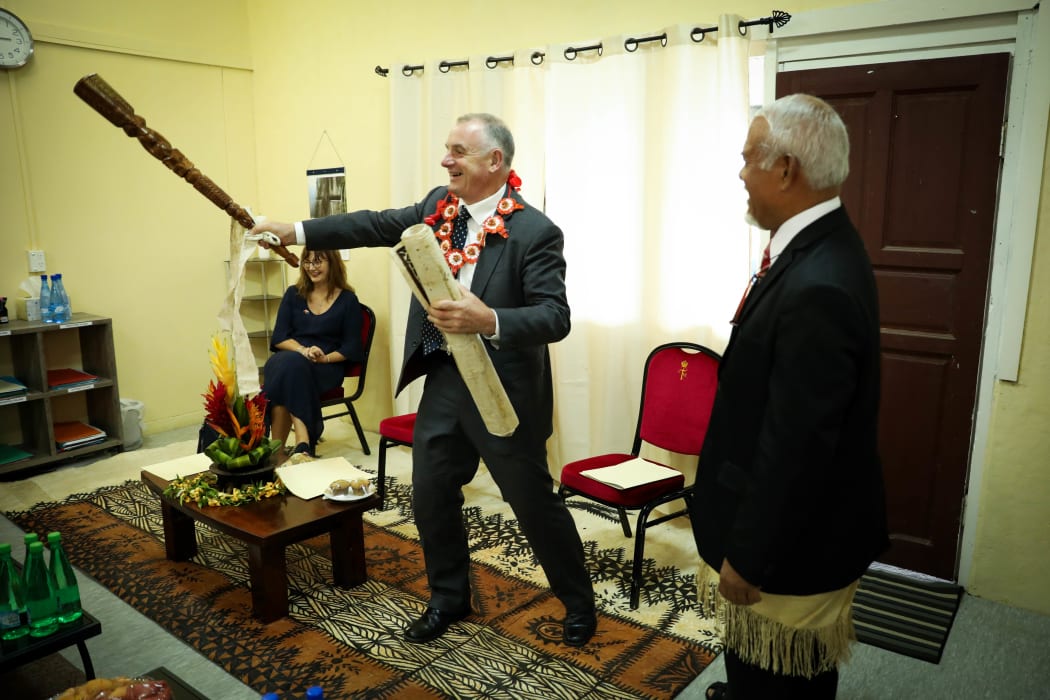 Speaker Trevor Mallard tests the reach of a club gifted to him by the Honourable Semisi Fakahau.
