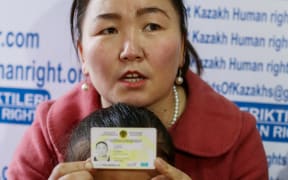 Gulzira Auelkhan, who spent close to two years trapped in China, speaks during an AFP interview at the office of the Ata Jurt rights group in Almaty, Kazakhstan, on January 21, 2019. She is pictured with her five-year-old daughter.