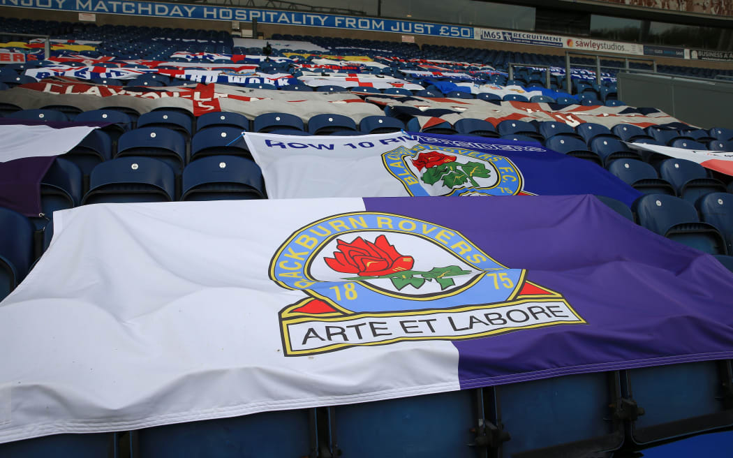 Blackburn Rovers fans' banners draped over seating on the Ronnie Clayton Blackburn end stand, empty due to the pandemic