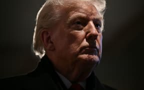 US President Donald Trump speaks during a stop at the Machine Shed restaurant in Urbandale, Iowa, on 27 January.