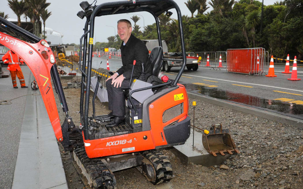 After visiting the rocks, construction workers building a path outside asked if Chris Hipkins wanted to try out the digger. Hipkins accepted the offer.