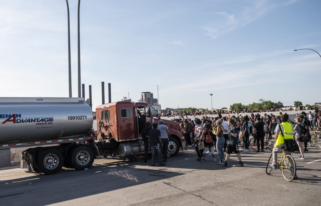 A large group of protesters had been marching over the bridge on both lanes before a truck drove into the crowd.