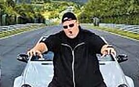 Kim Dotcom with seized cars.