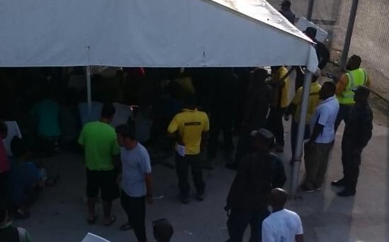 Immigration officials inside the Manus Island compound.