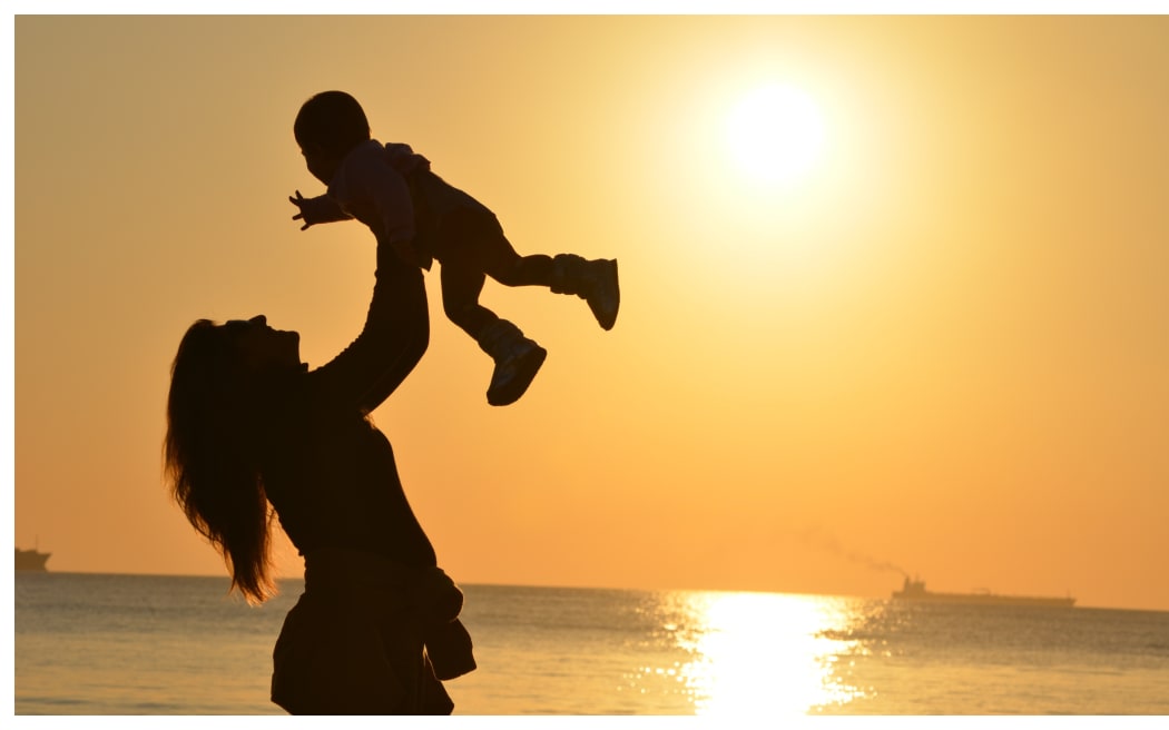 Mother and child at sunset