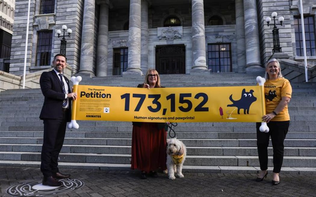 (from left) MPs Greg Fleming and Jenny Marcroft, and Animates gm marketing Nathalie Moolenschot, with  Frankie the golden doodle in the centre.