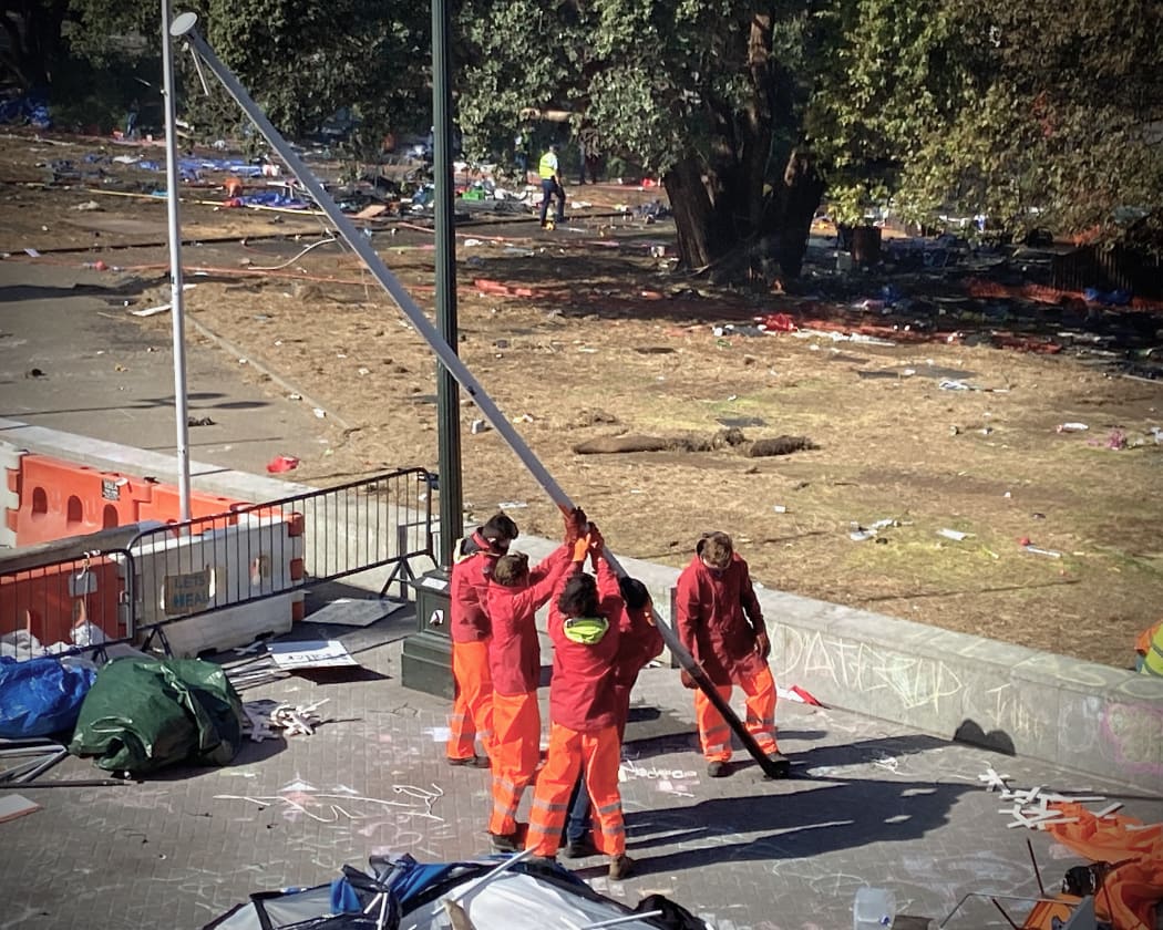 Even before the rioting is quite over a team is cleaning and replanting Parliament's flags, reminiscent of US Marines at Iwo Jima.