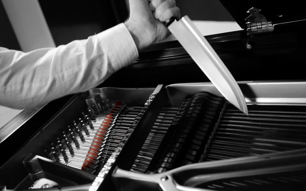 Joachim Horsley plays the piano with knives