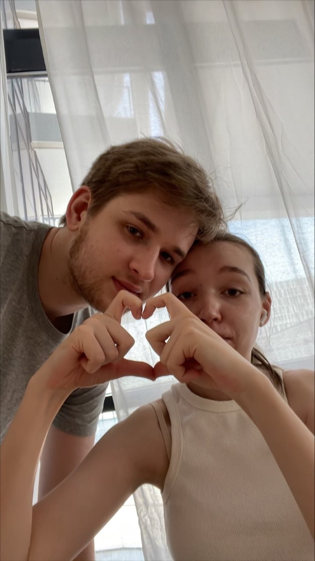 Yuriy Ackermann and his wife Alice - they sent this photo to their friends who are hiding in the underground car park to remind them that "we are with them, together in all of this"