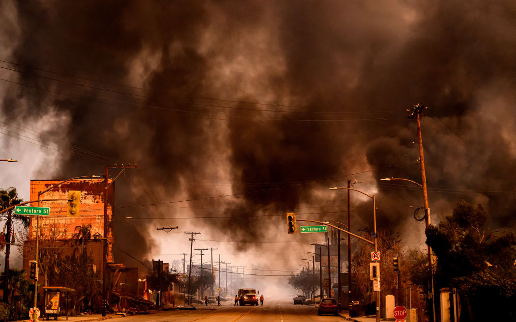 Smokes and flames overwhelms a commercial area during the Eaton fire in the Altadena area of Los Angeles County, California on January 8, 2025. - At least five people are now known to have died in wildfires raging around Los Angeles, with more deaths feared, law enforcement said January 8, as terrifying blazes leveled whole streets, torching cars and houses in minutes.
More than 1,000 buildings have burned in multiple wildfires that have erupted around America's second biggest city, forcing tens of thousands of people from their homes. (Photo by JOSH EDELSON / AFP)