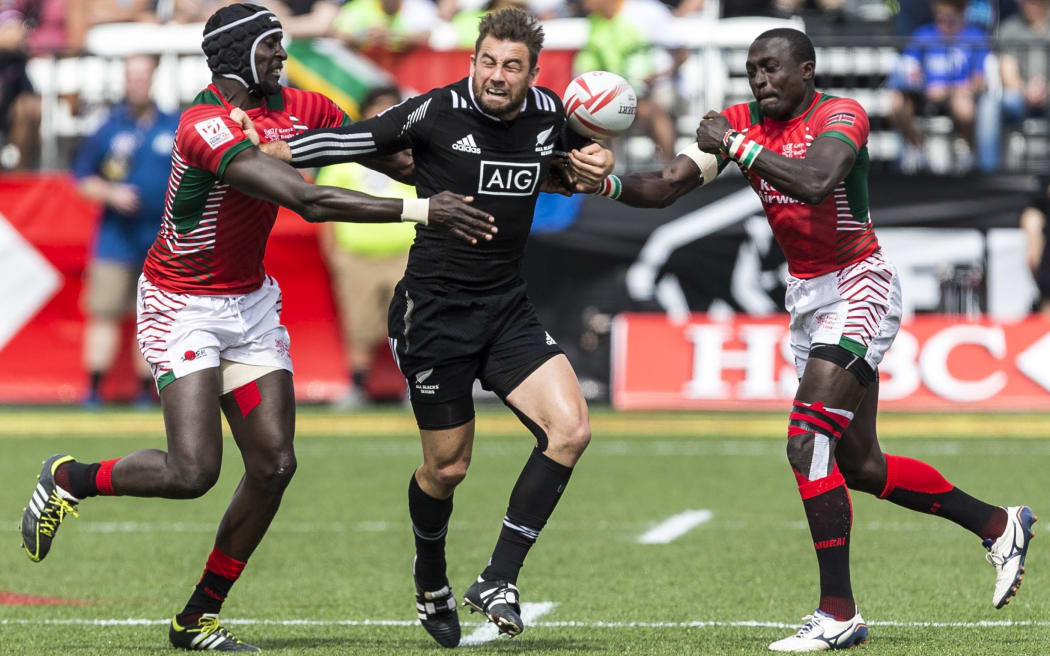 Kurt Baker is double teamed by Collins Injera and Andrew Amonde of Kenya.