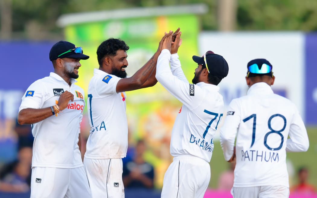 Prabath Jayasuriya and team mates.