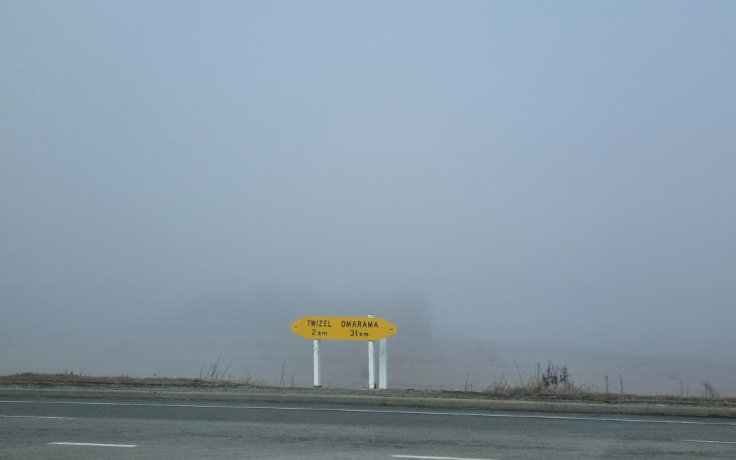 State Highway 8 sign between Omarama and Twizel, pictured 18 July, 2024, during foggy conditions.