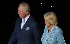 Britain's Prince Charles and his wife Camilla, the Duchess of Cornwall, attend the opening ceremony of the 2018 Gold Coast Commonwealth Games at the Carrara Stadium on the Gold Coast on April 4, 2018. / AFP PHOTO / Anthony WALLACE