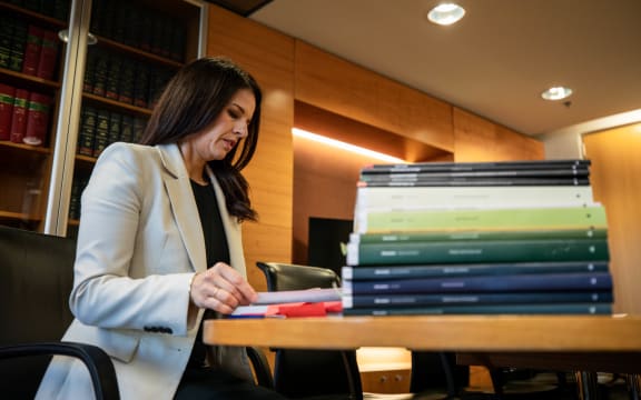 Erica Stanford with the Abuse in Care Inquiry report