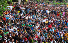 Students attend a rally at UPNG.
