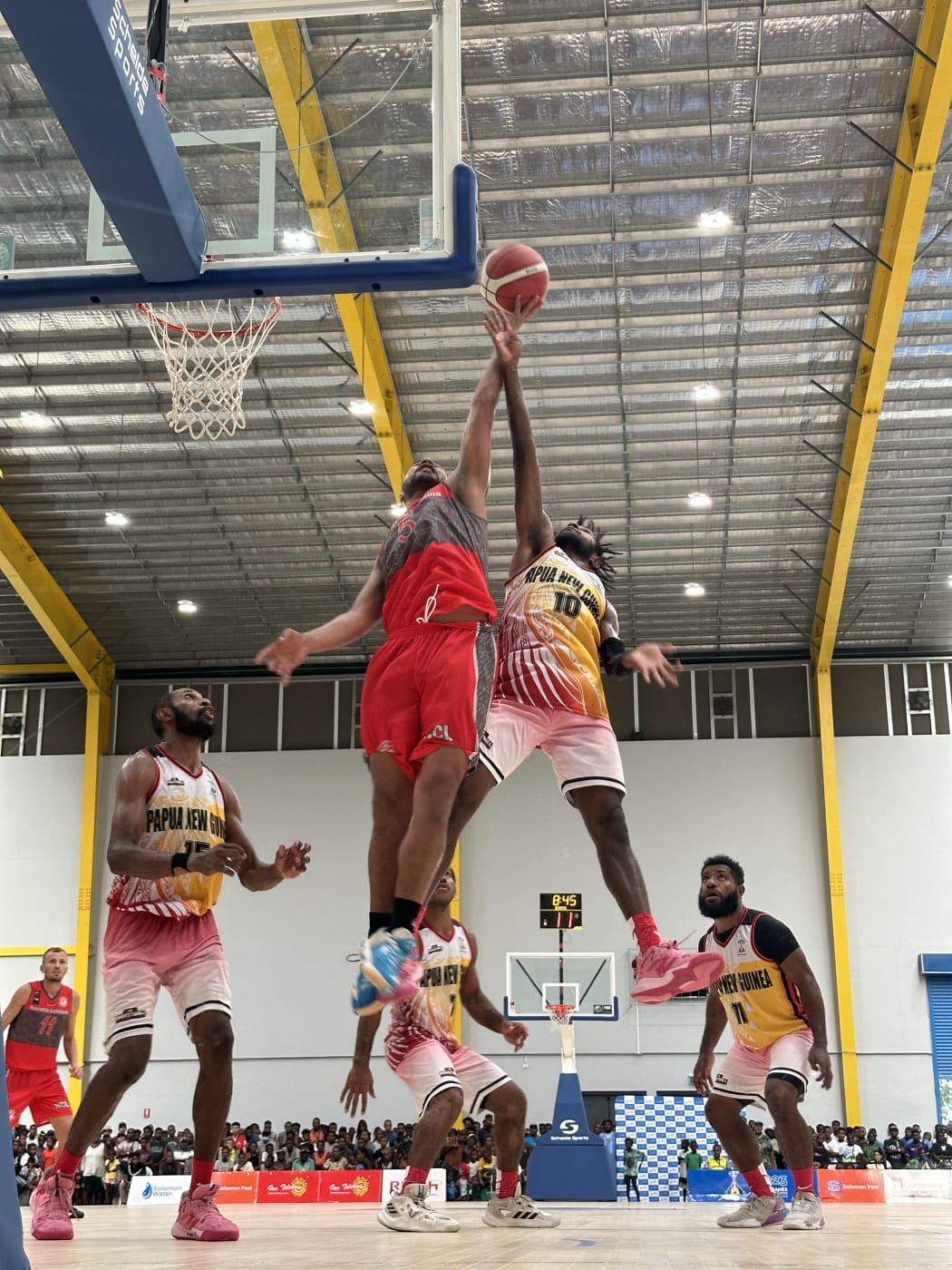 Pacific Airtime – Papua New Guinea’s Coni Muri (No.10) contests for the ball against New Caledonia’s Jean Sebastien Chevrin in their Pacific Games quarterfinal match. The Cagous went on to win 87-78 setting up a semi-final with Fiji. Friendship Hall 22 November 2023.