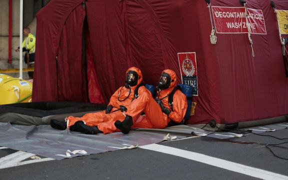 Officers in breathing apparatus worked at the decontamination tent.