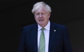 Britain's Prime Minister Boris Johnson visits the GS Kacyiru II school in Kigali on June 23, 2022, during the Commonwealth Heads of Government Meeting (CHOGM). - Leaders of Commonwealth countries meet every two years for the Commonwealth Heads of Government Meeting (CHOGM), hosted by different member countries on a rotating basis. Since 1971, a total of 24 meetings have been held, with the most recent being in the UK in 2018. (Photo by Dan Kitwood / POOL / AFP)