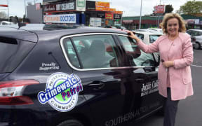 Judith Collins with the car she has been given for six months by a South Auckland company.
