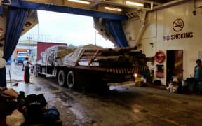 Materials are loaded onto the Lomaiviti Princess which is taking tonnes of supplies to Koro Island.
