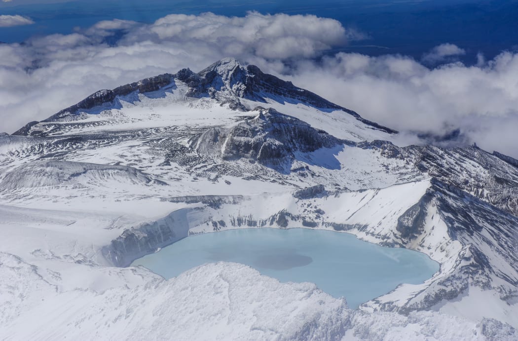 Aerial of a tuquoise crater lake on top of Mount Ruapehu, Tongariro National Park, UNESCO World Heritage Site, North Island, New Zealand, Pacific
