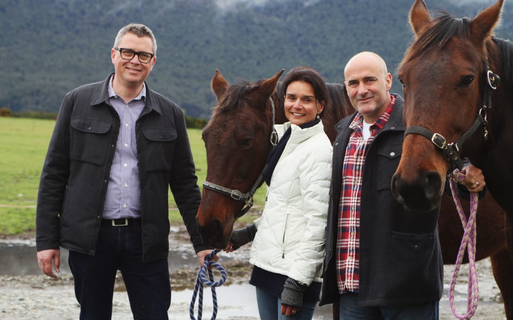 Ngāi Tahu Tourism chief executive Quinton Hall with Dart Stables' current owner Peter Davies and his wife Jenny Davies.