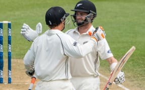 Kane Williamson celebrates his maiden test double century with teamate BJ Watling.