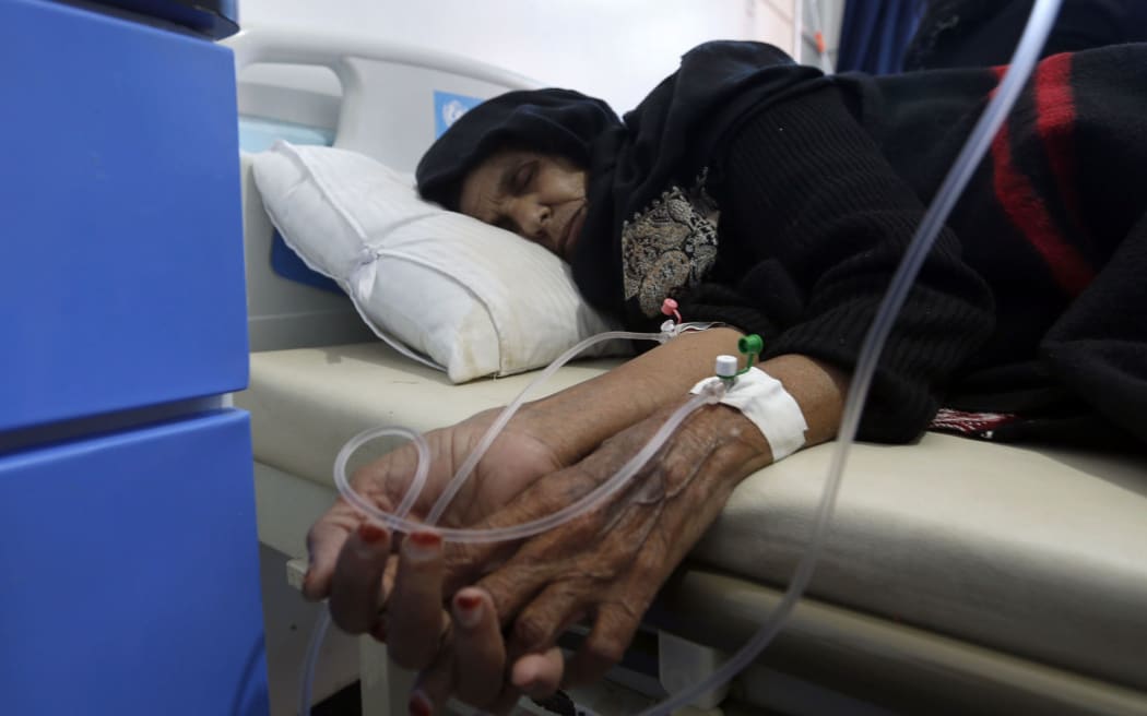 A Yemeni woman suspected of being infected with cholera receives treatment at a hospital in Sanaa on May 25, 2017.