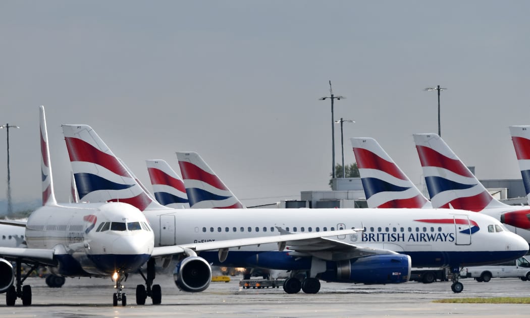 British Airways passenger aircraft are pictured at London Heathrow Airport, west of London on May 3, 2019. -