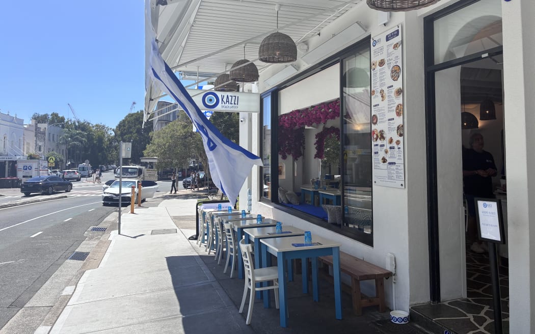 Kazzi Beach Greek at Bondi Beach displays an Israeli flag following the Bondi Beach attack.