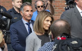 Actress Lori Loughlin and husband Mossimo Giannulli exit the Boston Federal Court house after a pre-trial hearing last year.