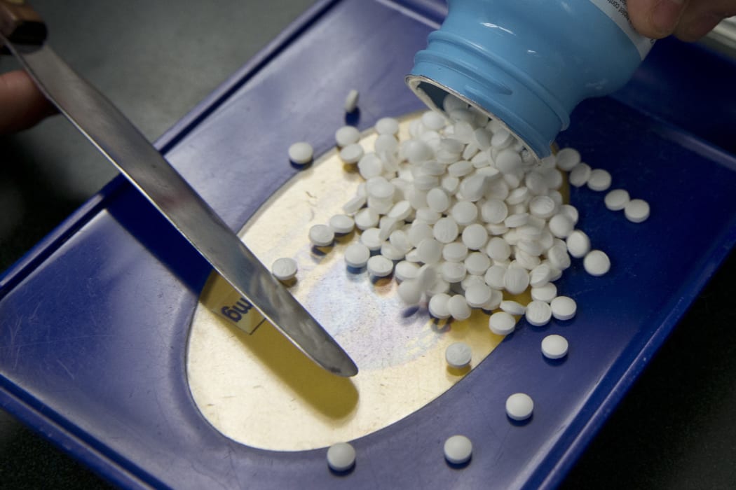 FILE - In this Friday, July 8, 2016, file photo, a prescription is filled at Pucci's Pharmacy, in Sacramento, Calif.  (AP Photo/Rich Pedroncelli, File)