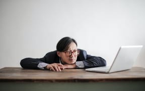 bored man on computer