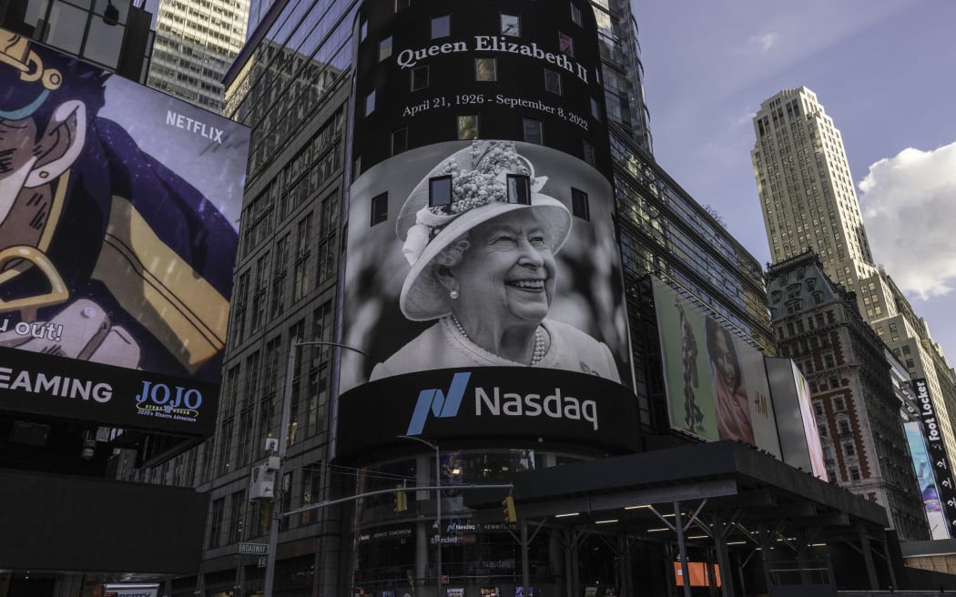 An image of Queen Elizabeth II is displayed at Times Square in New York on September 9, 2022 following her death at age 96. (Photo by Alex Kent / AFP)