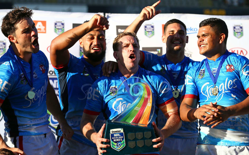 Roosters captain Mitchell Aubusson and his team mates celebrate their win in the final of the Auckland Nines.