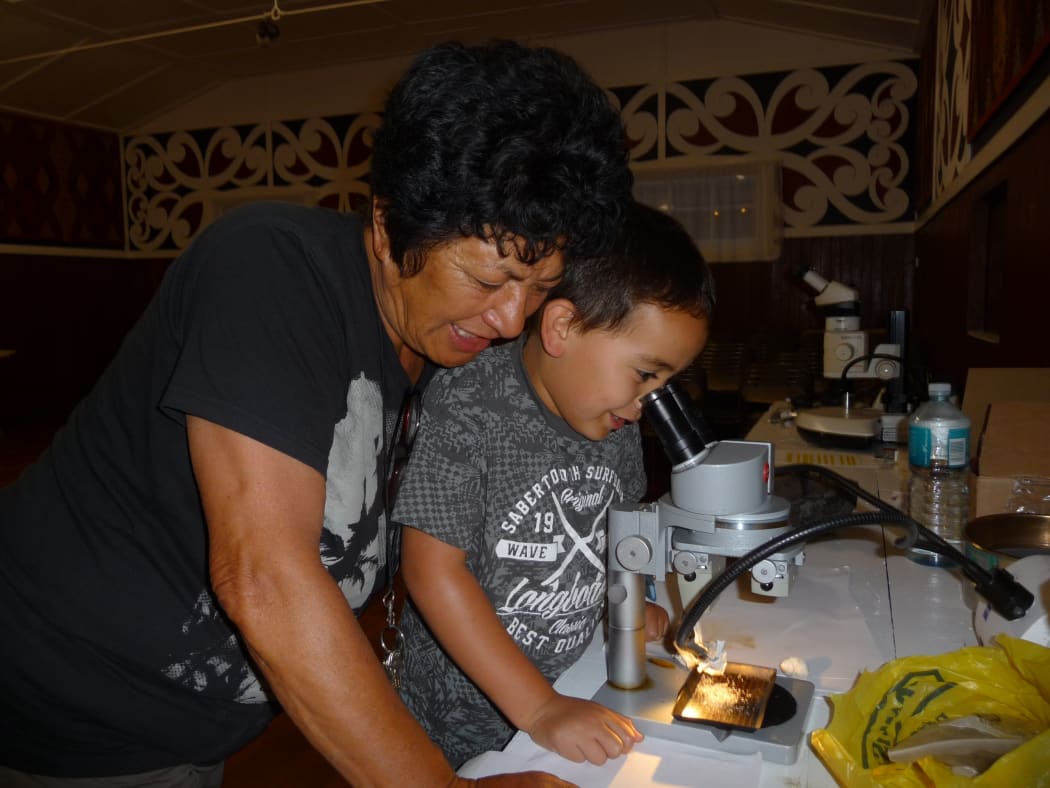 Kohupatiki Marae kuia Aki Paipa shares her geological knowledge with her mokopuna.