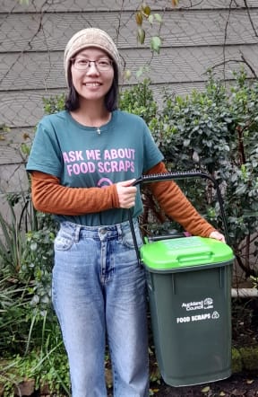 Wei He has been speaking with Chinese residents over the past several months to inform and encourage them to use the food scraps collection service.