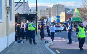 Emergency services have converged on an area near Dunedin’s police station after a fight which has left someone injured.