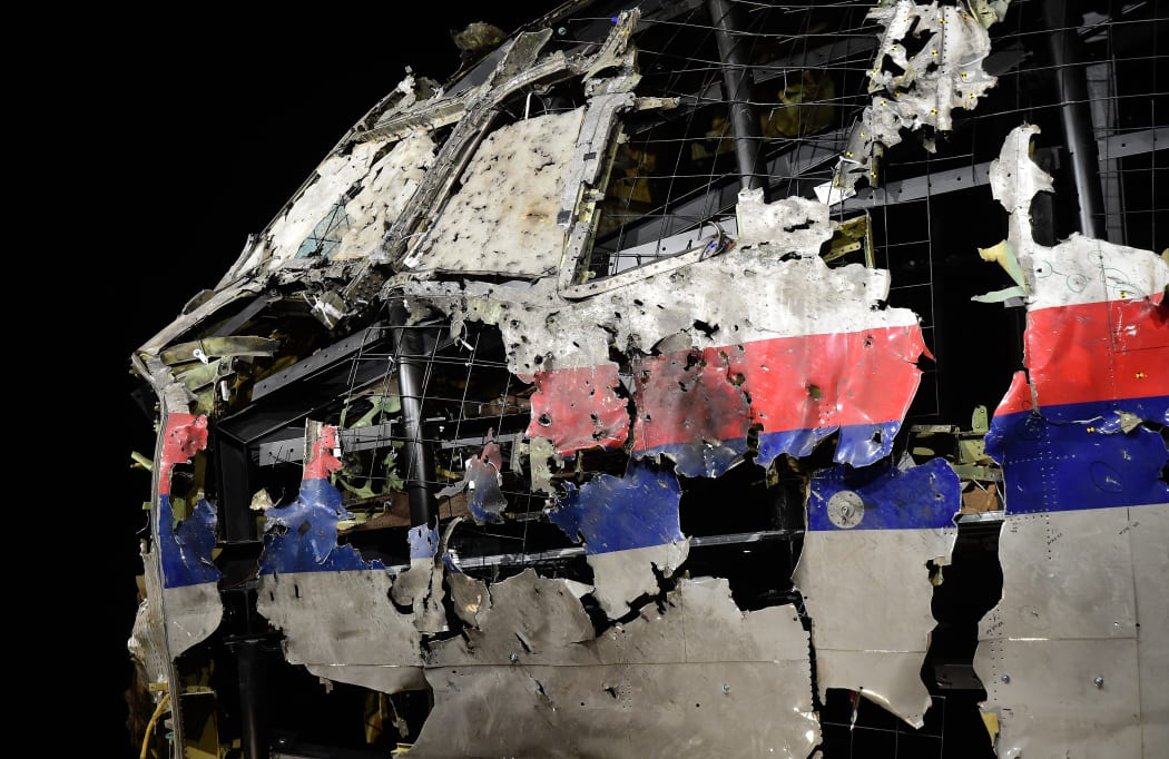 The wrecked cockipt of the Malaysia Airlines flight MH17 is exhibited during a presentation of the final report on the cause of the its crash at the Gilze-Rijen Air Base on 13 October 2015.