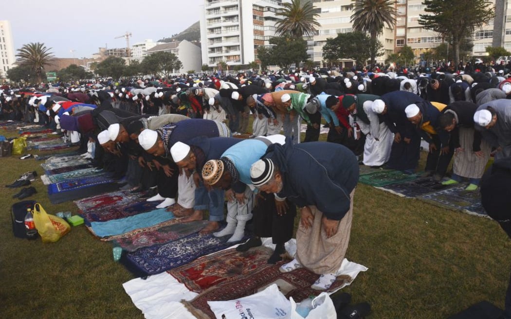 Muslim men pray in Cape Town, South Africa, on Sunday before trying to sight the new moon.