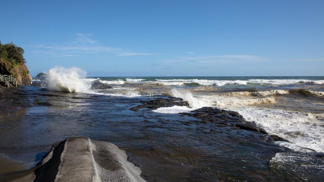 Muriwai Beach the day after a Burmese couple drowned while fishing off the rocks.