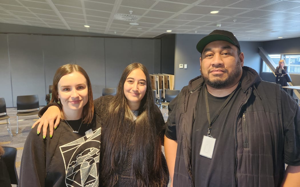 Former alternative education student Hayley-Jane with her former teachers Rose McIlhone and Nathaniel Hakeagaiki.
