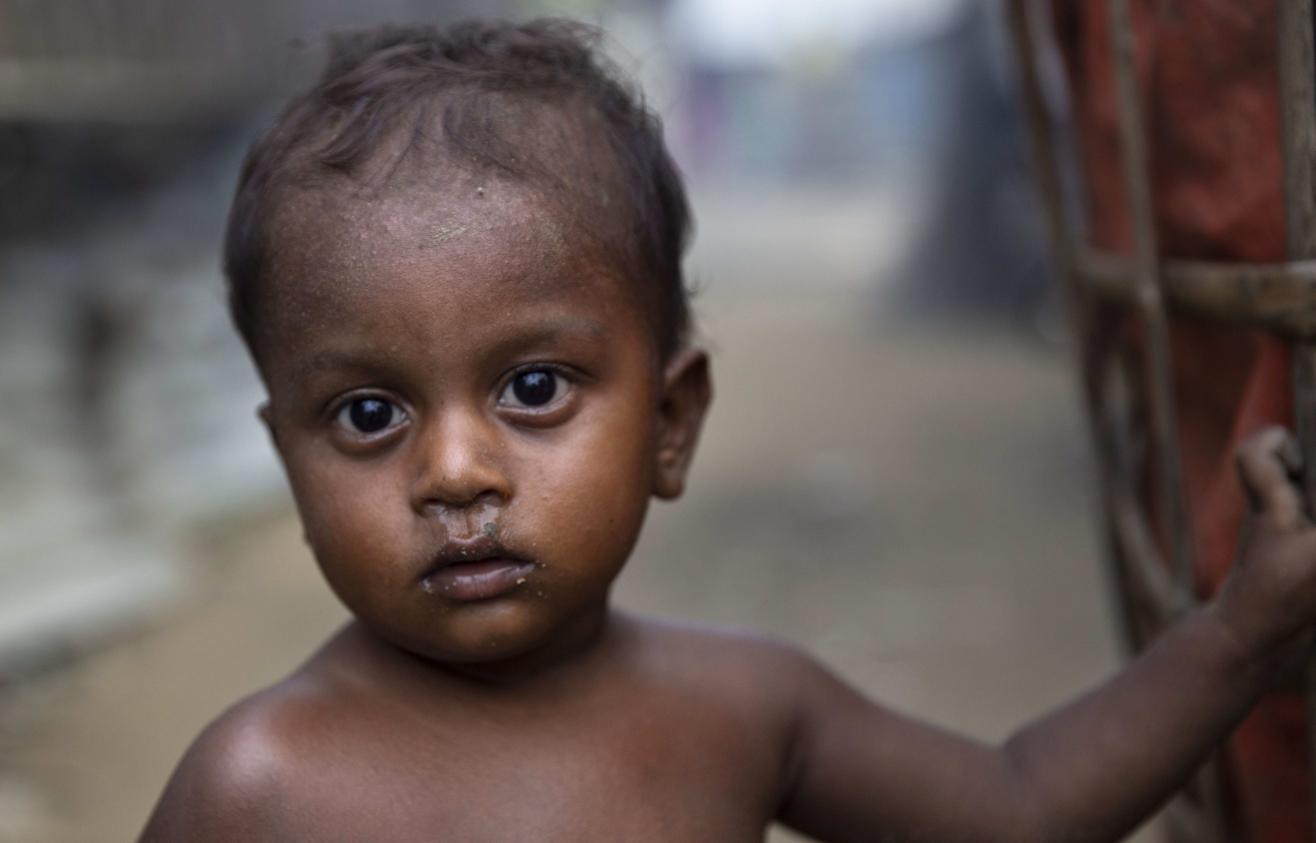 A Rohingya Muslim child stand outside a shelter at the Thet Kel Pyin camp in Rakhine state.
