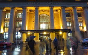 Commuters head into Wellington Railway Station.