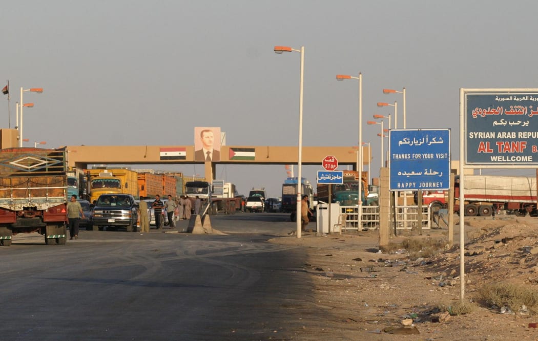 Cars wait in October 2004 at the Syrian-Iraqi border point of al-Tanf, 270km northeast of Damascus.