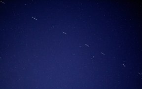The Starlink 3 train rides across the early morning sky, accompanied by a handful of other satellites.